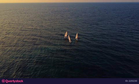small boats with sails float on surface of sea video 225230