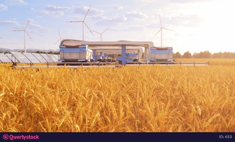 Harvesters on field with solar panels and windmills in the background 4K video 653